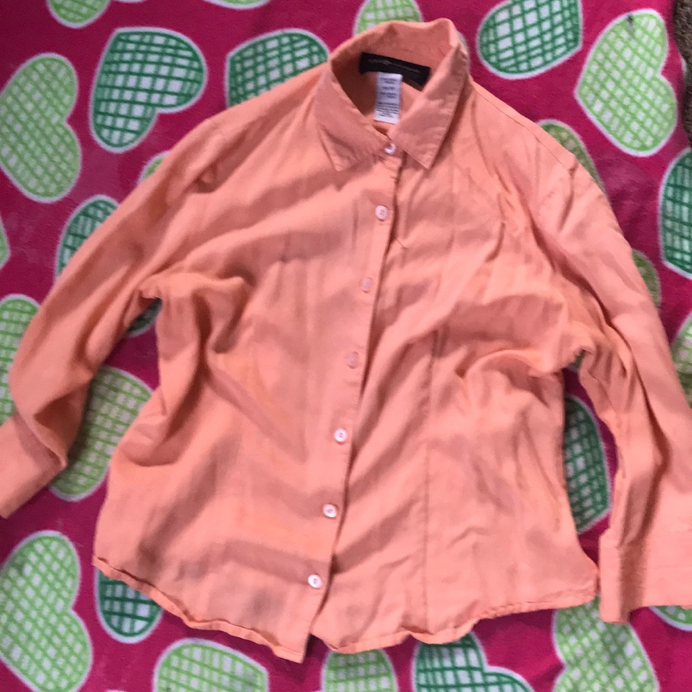 A pink woman top button down shirt